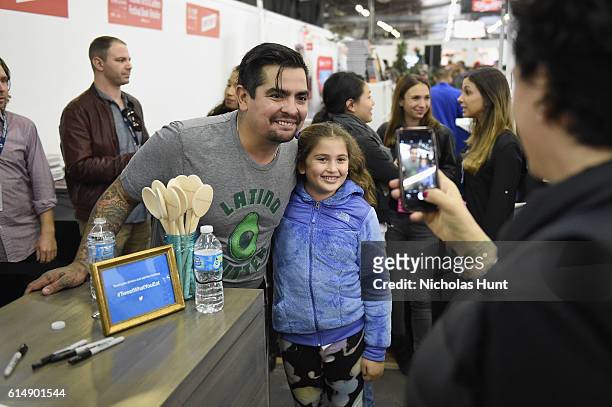 Chef Aaron Sanchez greets fans at the Food Network & Cooking Channel New York City Wine & Food Festival Presented By Coca-Cola - Grand Tasting...