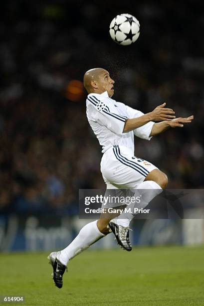 Roberto Carlos of Real Madrid heads the ball during the UEFA Champions League Final between Real Madrid and Bayer Leverkusen played at Hampden Park,...