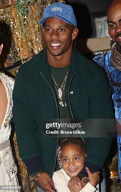 Giants Victor Cruz and daughter Kennedy Cruz pose backstage at "Disney's Aladdin" on Broadway at The New Amsterdam Theatre on October 15, 2016 in New...