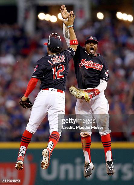 Francisco Lindor and Rajai Davis of the Cleveland Indians celebrate after defeating the Toronto Blue Jays with a score of 2 to 1 in game two of the...