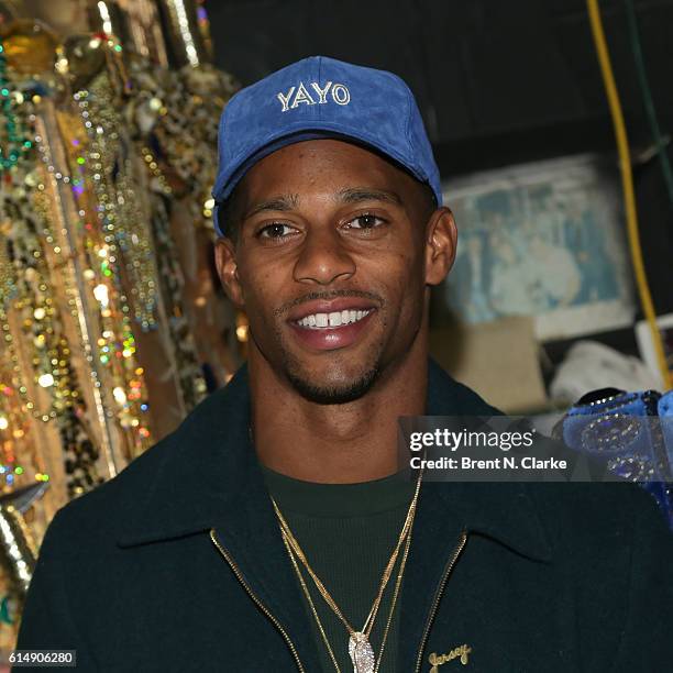 Professional football player Victor Cruz poses for photographs after attending "Aladdin" on Broadway at the New Amsterdam Theatre on October 15, 2016...