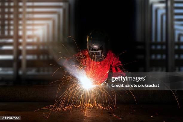 industrial worker welding metal - robotic car stock pictures, royalty-free photos & images