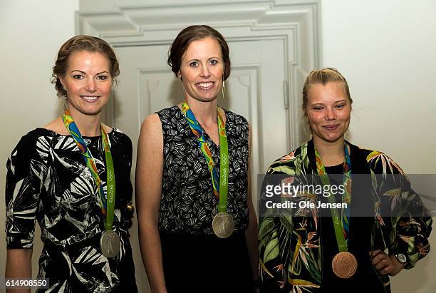 Danish Olympic medallists Mie Neilsen Christinna Pedersen and Kamilla Rytter Juhl Queen pose as they attend a reception hosted by Queen Margarethe of...