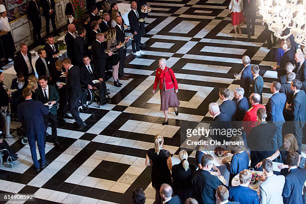 Queen Margrethe walks to the rostrum as she hosts a reception for the Danish Olympic and Para-Olympic Teams at Christiansborg on October 14, 2016 in...