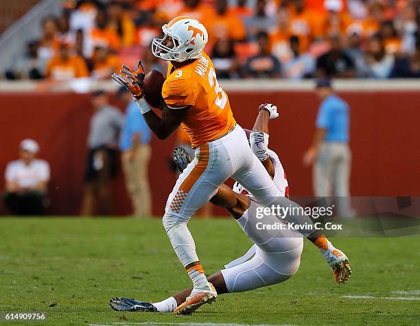 Josh Malone of the Tennessee Volunteers pulls in this reception against Minkah Fitzpatrick of the Alabama Crimson Tide at Neyland Stadium on October...