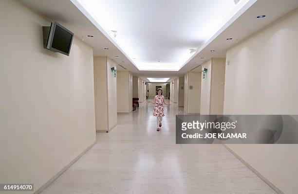 Year-old Alma Deutscher plays with her skipping rope in a hallway of The Wiener Musikverein in Vienna on October 6, 2016. The British 11-year-old's...