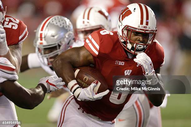 Corey Clement of the Wisconsin Badgers runs with the football during the first quarter against the Ohio State Buckeyes at Camp Randall Stadium on...