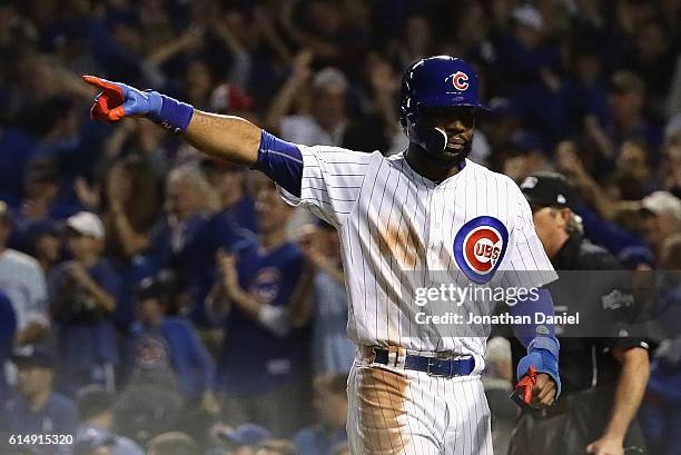 Jason Heyward of the Chicago Cubs celebrates after scoring a run in the second inning against the Los Angeles Dodgers during game one of the National...