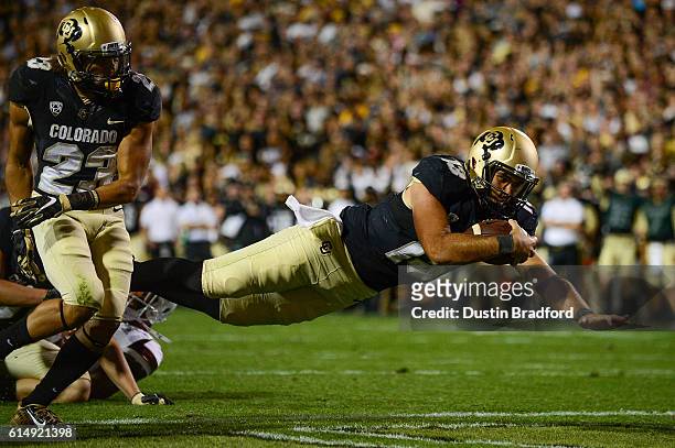 Colorado Buffaloes quarterback Sefo Liufau dives for a first half touchdown against the Arizona State Sun Devils at Folsom Field on October 15, 2016...