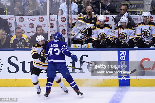 Toronto Maple Leafs Center Nazem Kadri body checks Boston Bruins Defenceman Torey Krug during the first period of the NHL regular season game between...