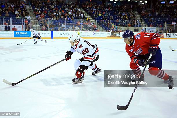 Ondrej Machala of the Niagara IceDogs skates with the puck as Domenic Commisso of the Oshawa Generals chases during the second period of an OHL game...