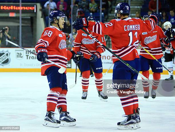Domenic Commisso of the Oshawa Generals celebrates a goal with Mitchell Vande Sompel during the second period of an OHL game against the Niagara...