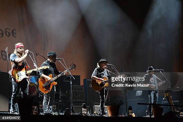 Musicians Lukas Nelson, Corey McCormick, Neil Young and Jacob Micah Nelson of Neil Young & Promise of the Real perform onstage during Desert Trip at...