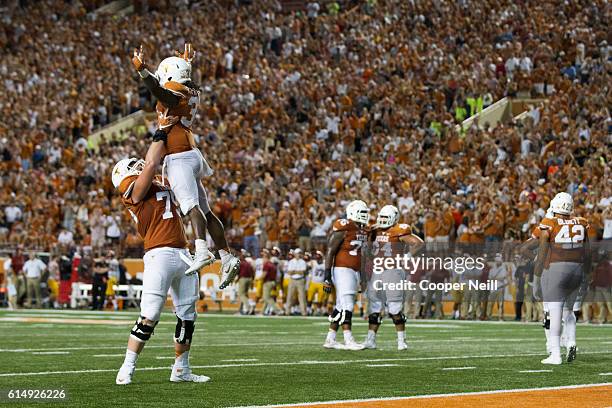 Onta Foreman of the Texas Longhorns celebrates after an 18 yard touchdown run against the Iowa State Cyclones during the second half on October 15,...