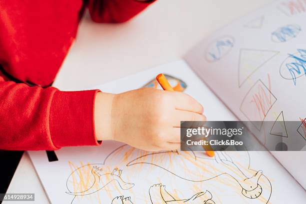 a child's hand painting - dinosaur drawing stock pictures, royalty-free photos & images