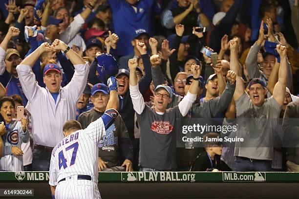 Miguel Montero of the Chicago Cubs celebrates hitting a grand slam home run in the eighth inning against the Los Angeles Dodgers during game one of...