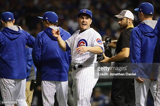 Miguel Montero of the Chicago Cubs celebrates after defeating the Los Angeles Dodgers 8-4 in game one of the National League Championship Series at...