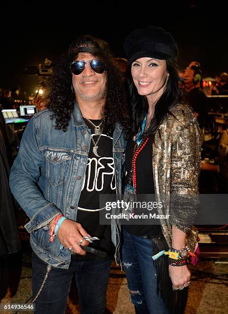 Musician Slash and Meegan Hodges attend Desert Trip at The Empire Polo Club on October 15, 2016 in Indio, California.