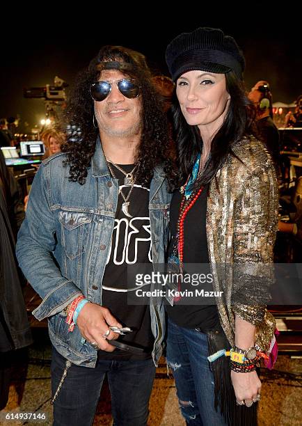 Musician Slash and Meegan Hodges attend Desert Trip at The Empire Polo Club on October 15, 2016 in Indio, California.