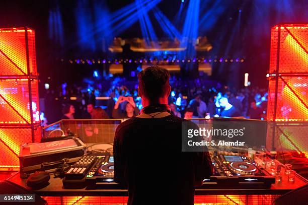 The DJ plays music during the MBFWIxPSM closing party for Mercedes-Benz Fashion Week Istanbul at Zorlu Center on October 15, 2016 in Istanbul, Turkey.