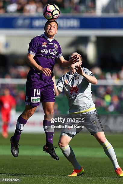 Chris Harold of the Glory and Adam Parkhouse of the Phoenix contest a header during the round two A-League match between the Perth Glory and the...