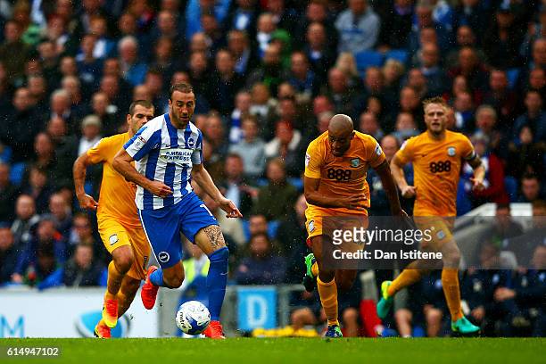 Glenn Murray of Brighton & Hove Albion battles for the ball with Alex John-Baptiste of Preston North End during the Sky Bet Championship match...