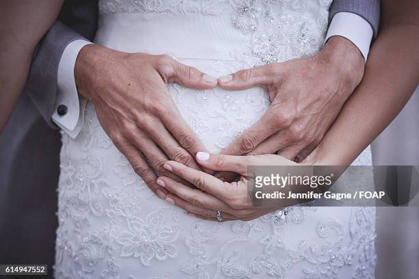 newlywed with pregnant bride - wedding ceremony stock-fotos und bilder