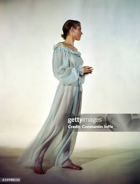Model in blue negligee of Bemberg sheer rayon.