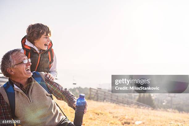 grandfather and grandson in nature - approaching bildbanksfoton och bilder