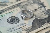 diamond ring on money