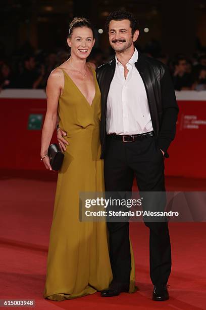 Milena Mancini and Vinicio Marchioni walk a red carpet for 'Sole Cuore Amore' during the 11th Rome Film Festival at Auditorium Parco Della Musica on...