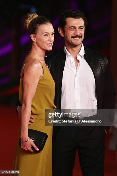 Milena Mancini and Vinicio Marchioni walk a red carpet for 'Sole Cuore Amore' during the 11th Rome Film Festival at Auditorium Parco Della Musica on...