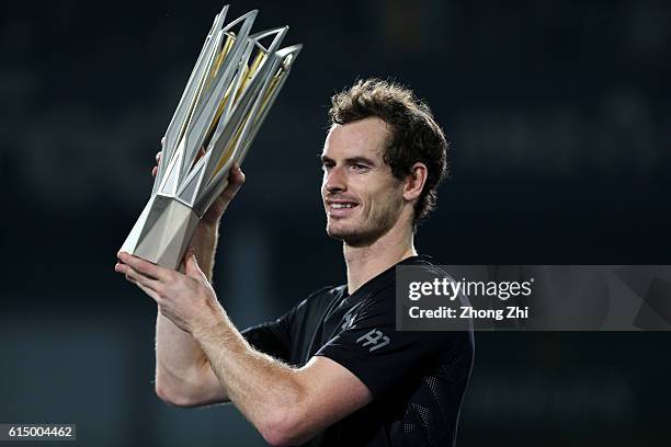 Andy Murray of Great Britain celebrates with his trophy during the award ceremony after winning the Men's singles final match against Roberto...