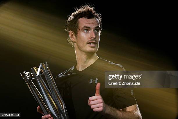 Andy Murray of Great Britain celebrates with his trophy during the award ceremony after winning the Men's singles final match against Roberto...