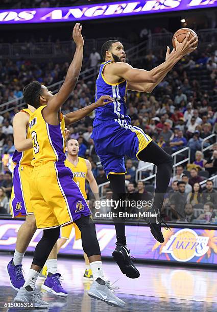JaVale McGee of the Golden State Warriors drives to the basket against Anthony Brown of the Los Angeles Lakers during their preseason game at...