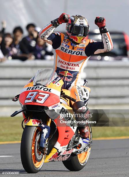 Honda rider Marc Marquez of Spain celebrates after winning the Japanese Grand Prix at Motegi Twin Ring in Tochigi Prefecture, north of Tokyo, on Oct....