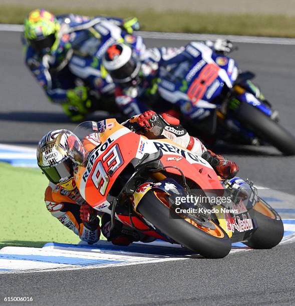 Honda rider Marc Marquez of Spain steers on his way to winning the Japanese Grand Prix at Motegi Twin Ring in Tochigi Prefecture, north of Tokyo, on...