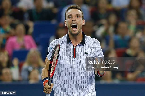 Roberto Bautista Agut of Spain reacts after losing the point against Andy Murray of Great Britain during men's singles final match on day eight of...