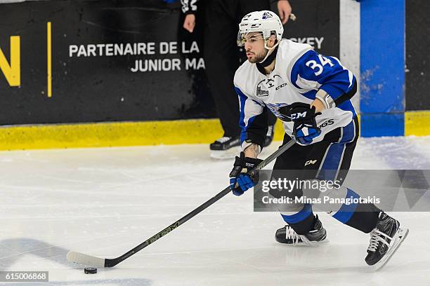 Chase Stewart of the Saint John Sea Dogs skates with the puck during the QMJHL game against the Blainville-Boisbriand Armada at the Centre...