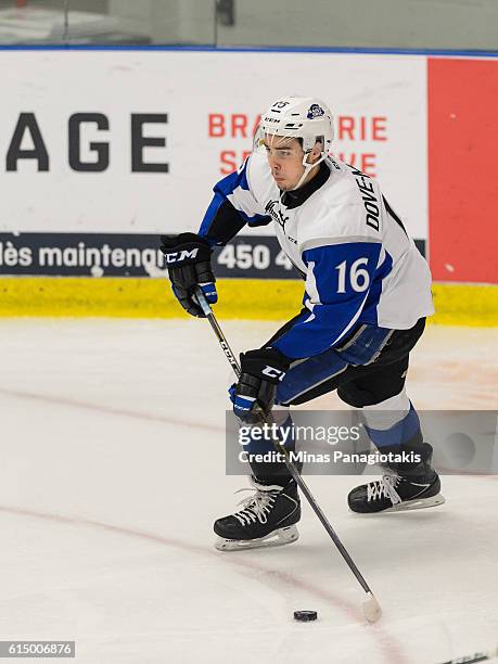 Samuel Dove-McFalls of the Saint John Sea Dogs skates the puck during the QMJHL game against the Blainville-Boisbriand Armada at the Centre...