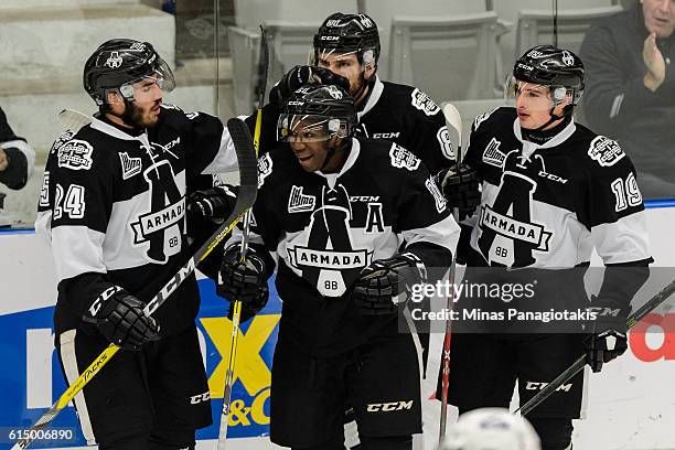 Yvan Mongo of the Blainville-Boisbriand Armada celebrates a goal with teammates during the QMJHL game against the Saint John Sea Dogs at the Centre...