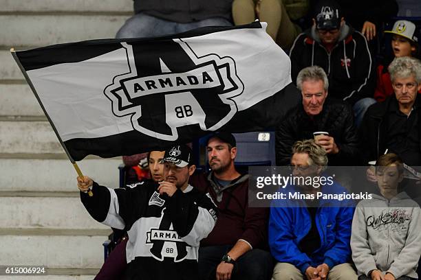 Fan waves a Blainville-Boisbriand Armada flag during the QMJHL game against the Saint John Sea Dogs at the Centre d'Excellence Sports Rousseau on...