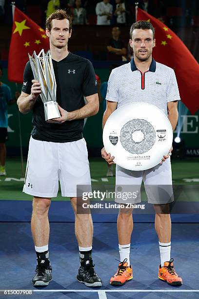 Andy Murray of Great Britain and Roberto Bautista Agut of Spain poses with their trophy after the Men's Single Final Match on day eight of Shanghai...