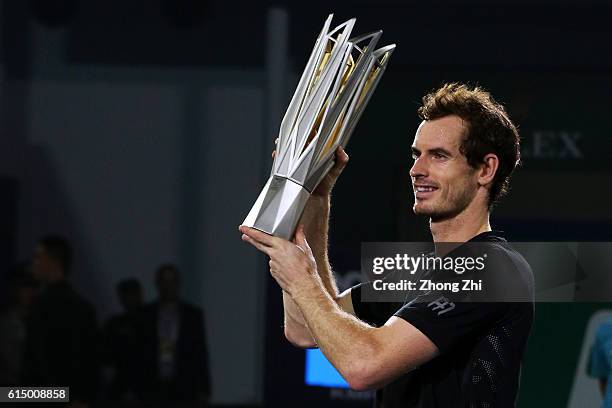 Andy Murray of Great Britain celebrates with his trophy during the award ceremony after winning the Men's singles final match against Roberto...