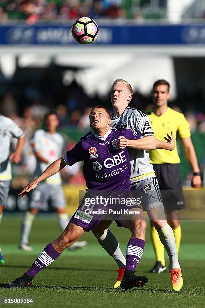 Chris Harold of the Glory and Adam Parkhouse of the Phoenix contest for the ball during the round two A-League match between the Perth Glory and the...