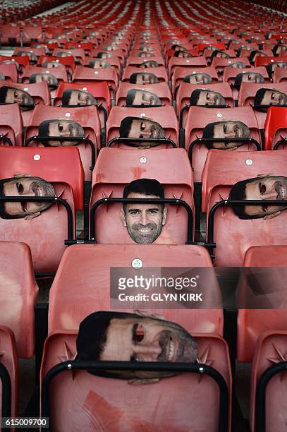 Face masks of former Southampton player Francis Benali are pictured on the seats ahead of the English Premier League football match between...
