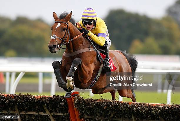 Harry Cobden riding Cliffs Of Dover clear the last to win The racinguk.com/hd Juvenile Hurdle Race at Kempton Park on October 16, 2016 in Sunbury,...