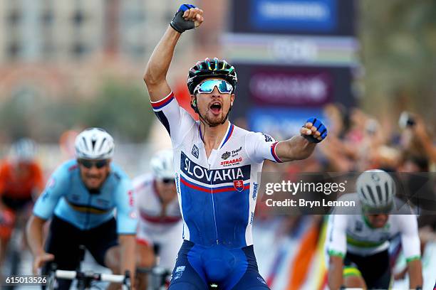 Peter Sagan of Slovakia celebrates victory as he crosses the finish line in the Elite Men's Road Race on day eight of the UCI Road World...