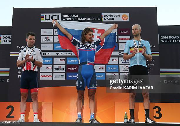 Britain's silver medallist Mark Cavendish, Slovakia's gold medallist Peter Sagan and Belgium's bronze medallist Tom Boonen celebrate on the podium at...