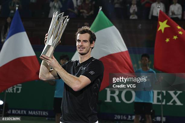 Andy Murray of Great Britain celebrates with the trophy after winning the Men's singles final match against Roberto Bautista Agut of Spain on day 8...